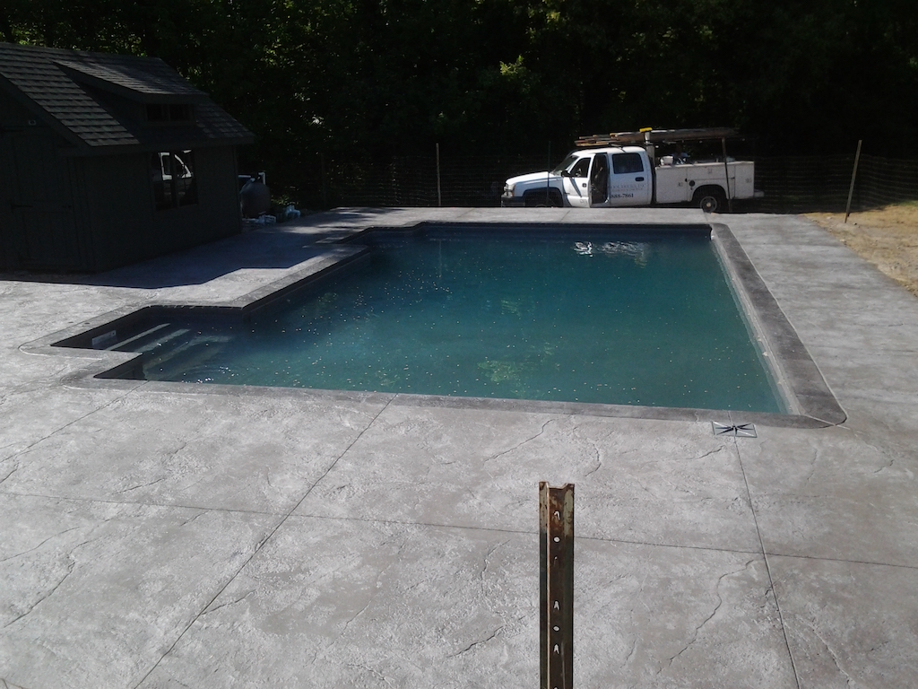 Swimming pool and stamped concrete project example 141